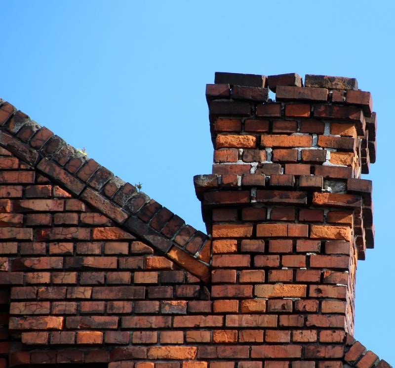 Signs Your Oak Park Home Needs a Chimney Inspection Damaged chimney on an Oak Park home showing cracks and missing mortar